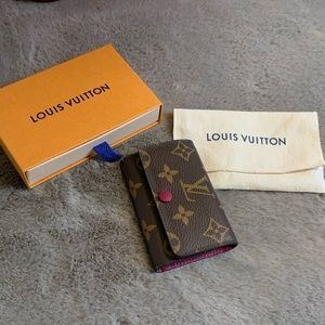 Louis Vuitton 6 ring key holder in monogram and magenta interior.